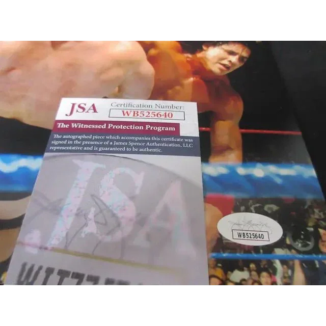 JSA authenticated Tito Santana signed 8x10 photo of wrestling ring action