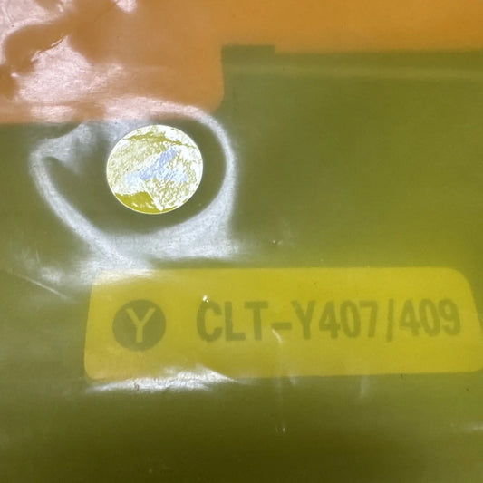Toner cartridge CLT-Y407/409 circular metallic component with reflective blue yellow patterns