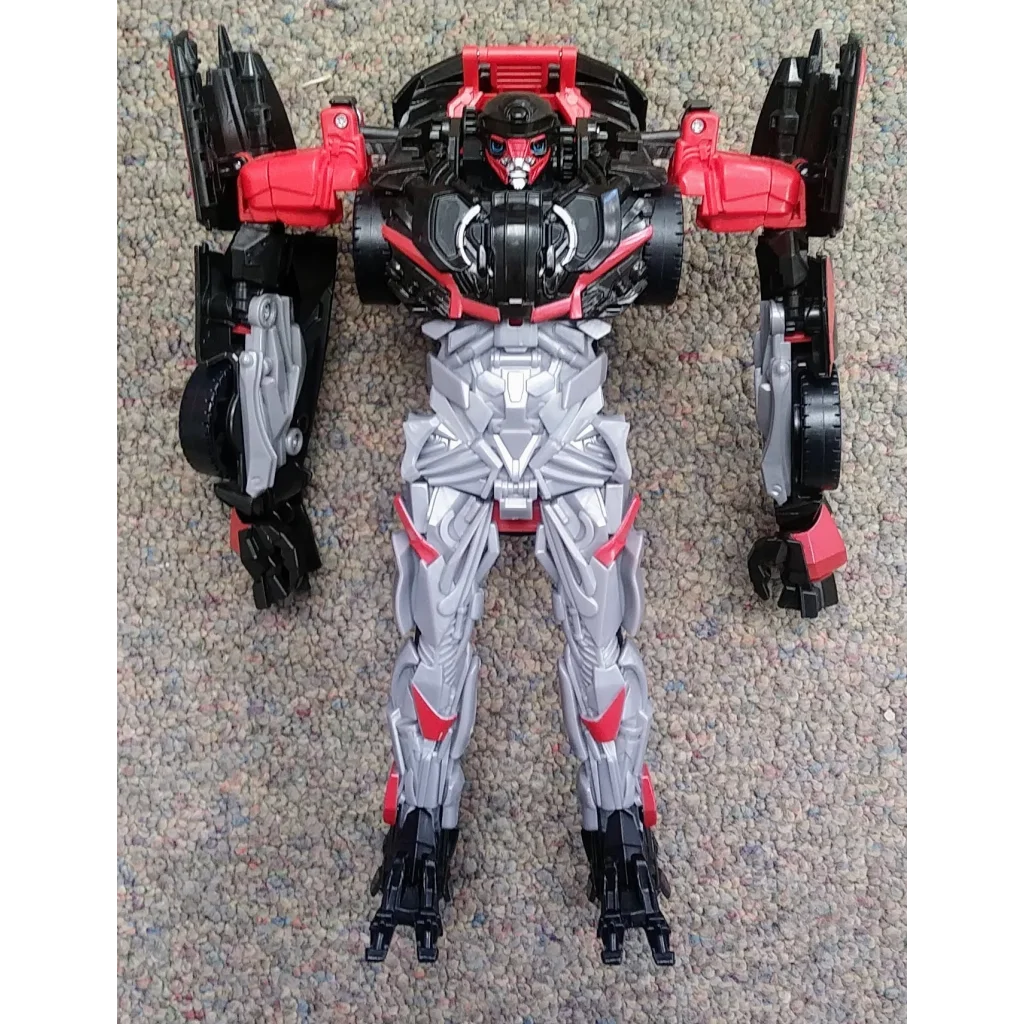 Hot Rod Transformers action figure in silver, red and black