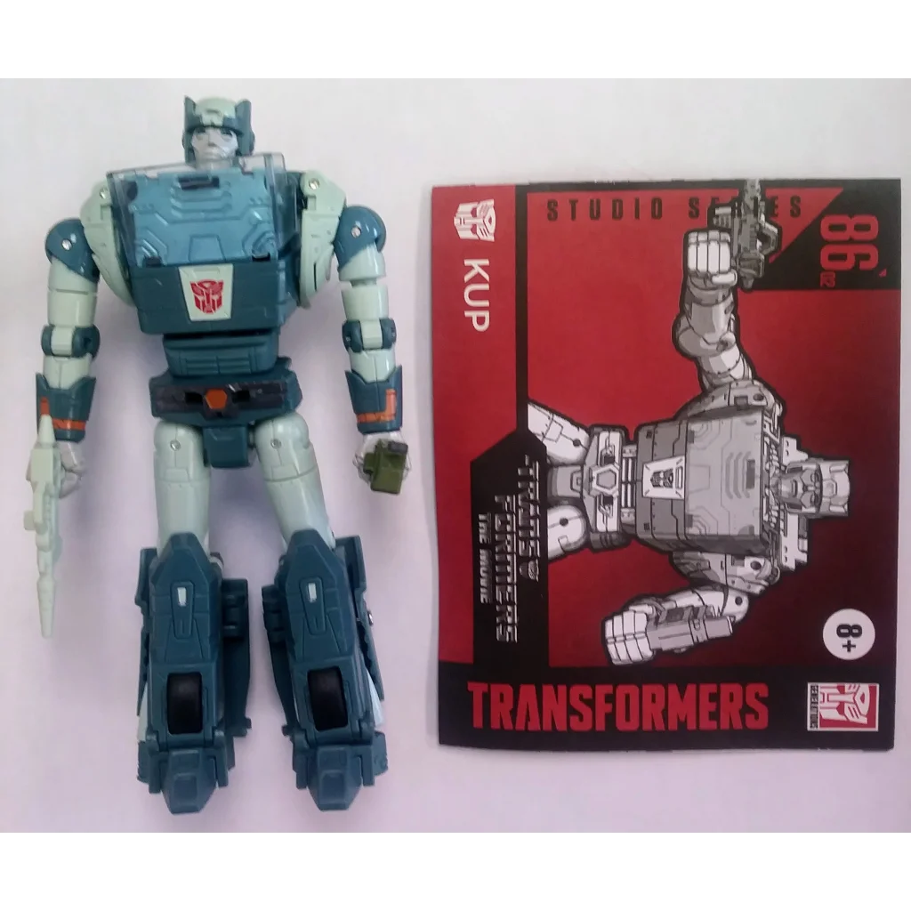 Transformers action figure Autobot Kup with blue silver accents on red packaging