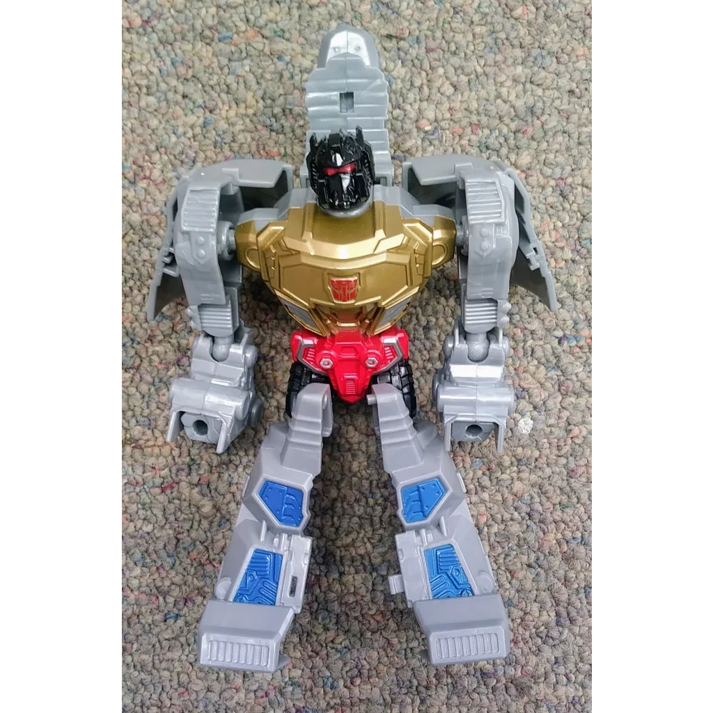 Grimlock Dinobot Transformers action figure in silver gold with red accents