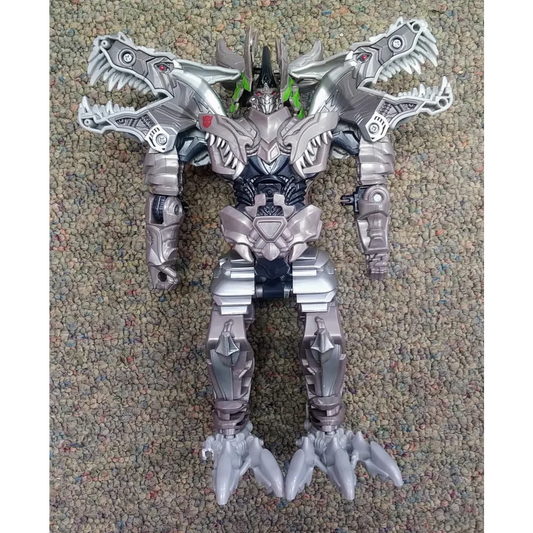 Silver and black Transformers action figure Dinobot Grimlock with metallic finish