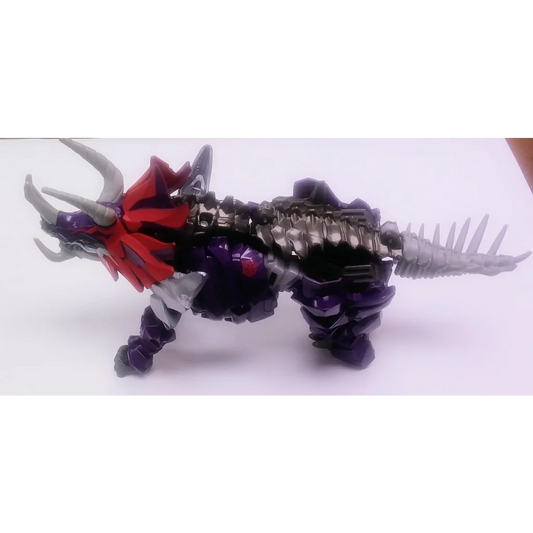 Black and red Dinobot Slug Transformers action figure with purple accents