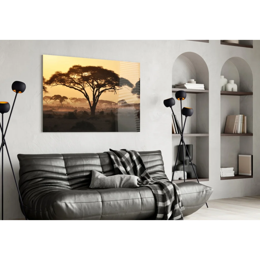 Sleek dark gray leather sofa under African Sunset glass wall art