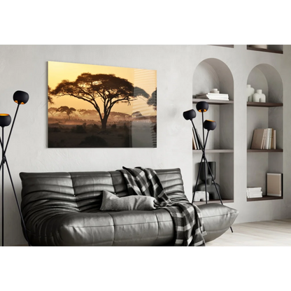 Sleek dark gray leather sofa under African Sunset glass wall art