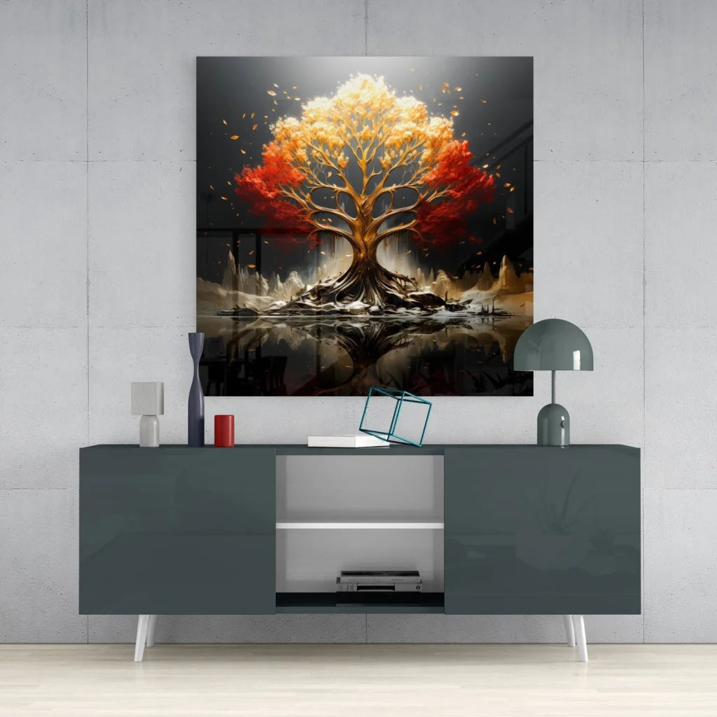 Stunning tempered glass art of vibrant autumn tree with fiery orange and red foliage on dark background, mounted above modern gray console table