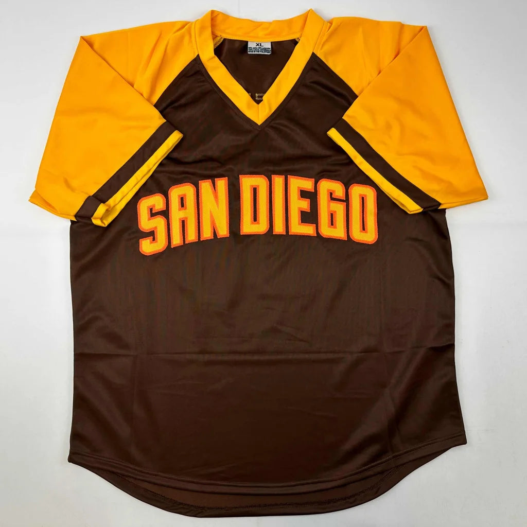 Brown and gold V-neck short-sleeved custom jersey from Trevor Hoffman signed by a baseball legend