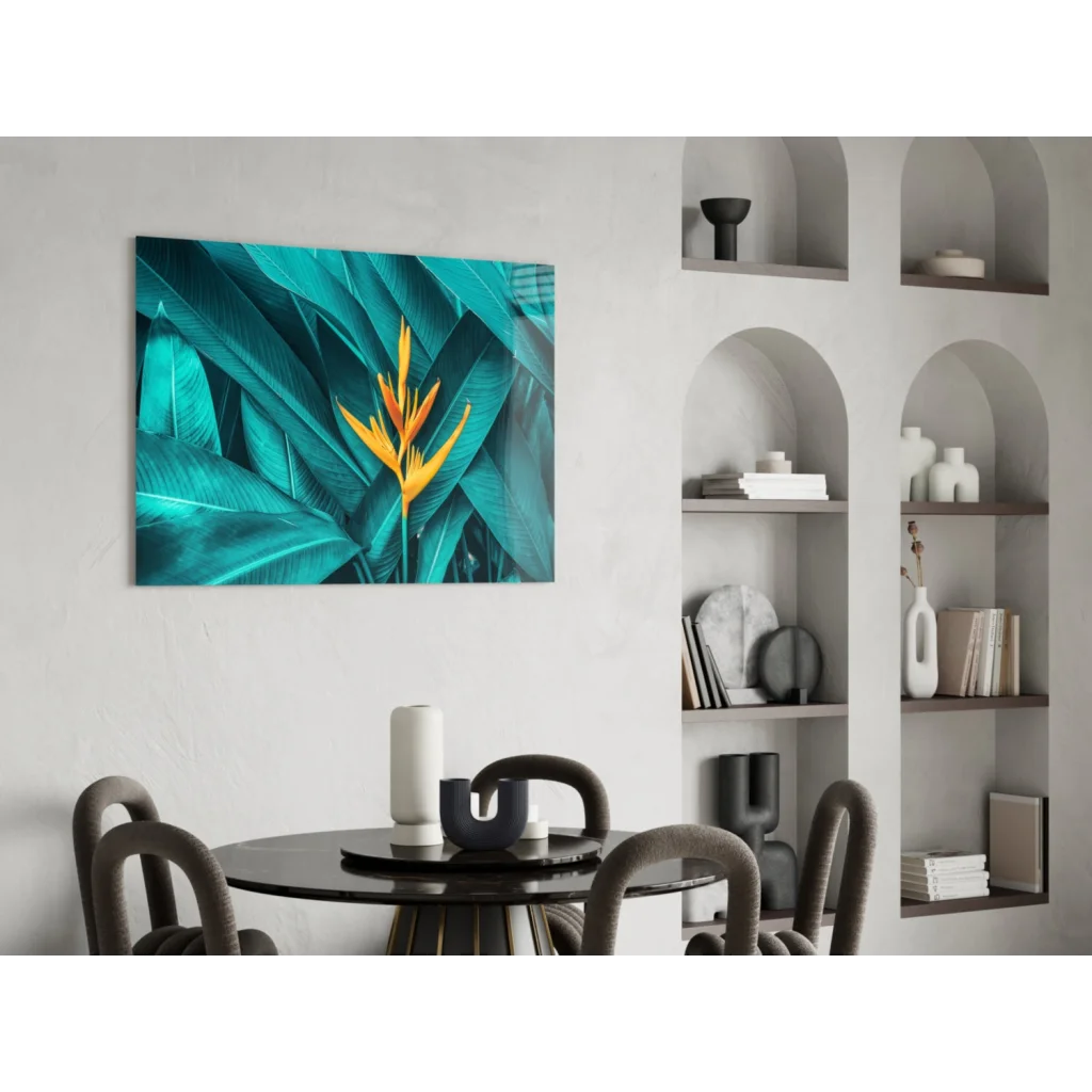 Vibrant teal and yellow bird of paradise glass wall art on wall