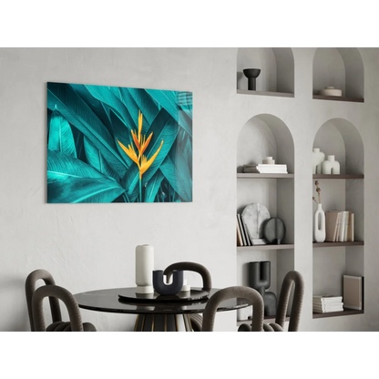 Vibrant teal and yellow bird of paradise glass wall art on wall