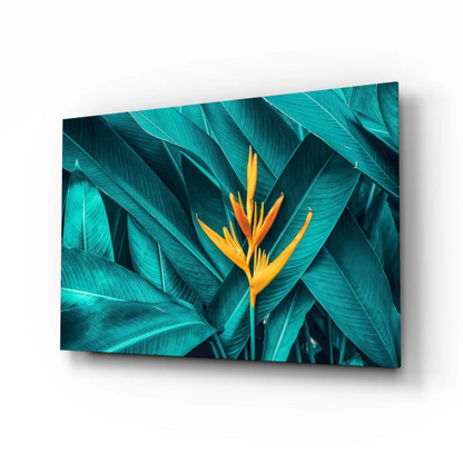 Vibrant yellow bird-of-paradise glass wall art in teal leaves