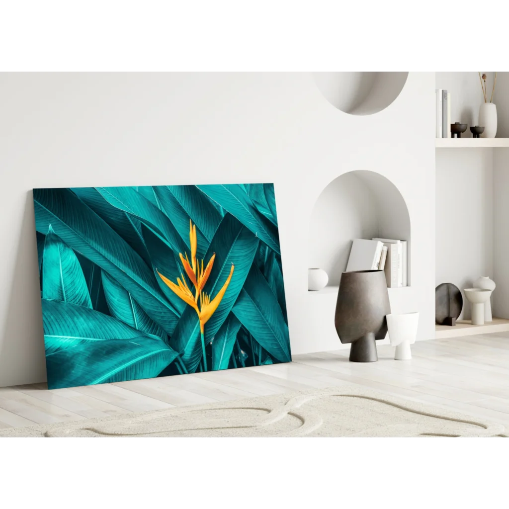 Vibrant teal and yellow bird of paradise glass wall art