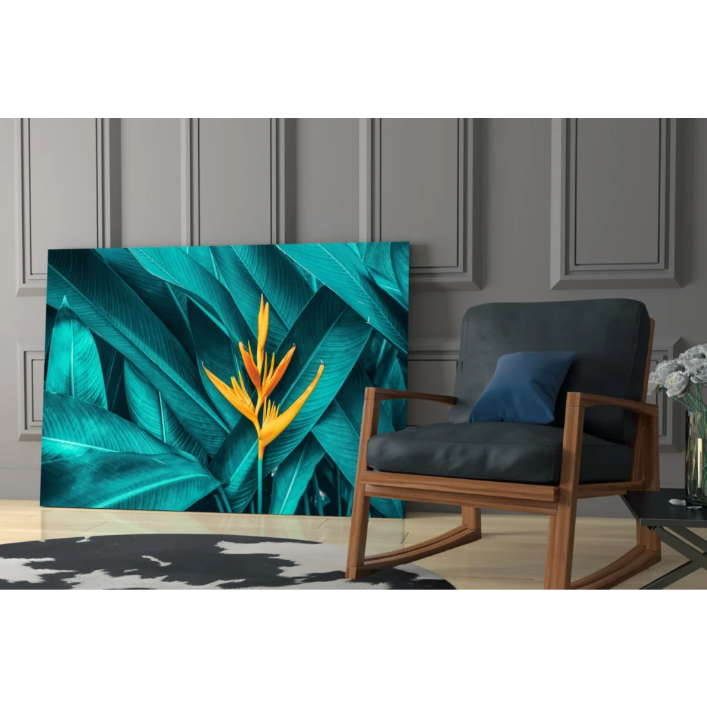 Vibrant teal and yellow bird of paradise glass wall art