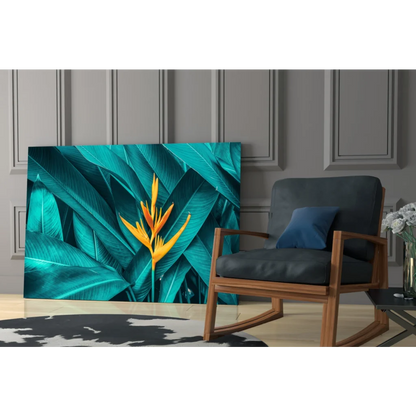 Vibrant teal and yellow bird of paradise glass wall art