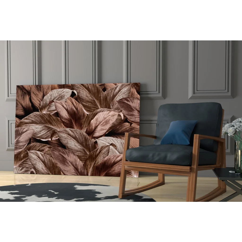 Tropical leaf glass wall art with metallic bronze shimmer on gray wall