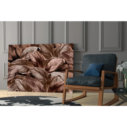 Tropical leaf glass wall art with metallic bronze shimmer on gray wall