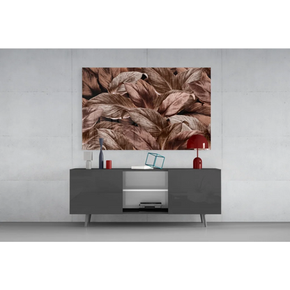 Close-up brown beige feathers on glass wall art with bronze shimmer