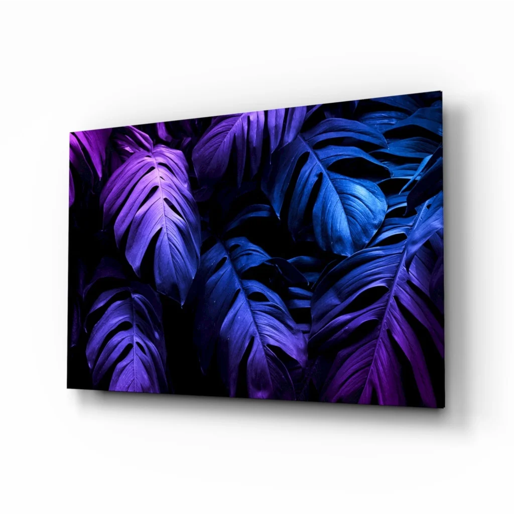 Stunning purple monstera glass wall art print with tropical leaves