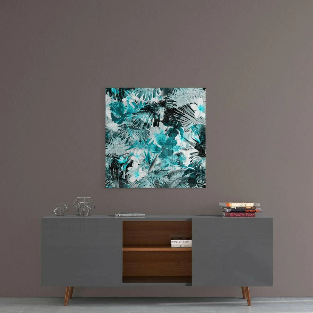 Tropical Teal Hibiscus glass wall art with vibrant leaf pattern above gray sideboard