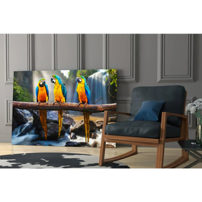 Vibrant blue and yellow macaws on branch by waterfall, canvas wall art