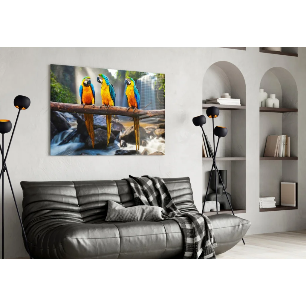 Vibrant blue and yellow macaws on branch by waterfall canvas wall art