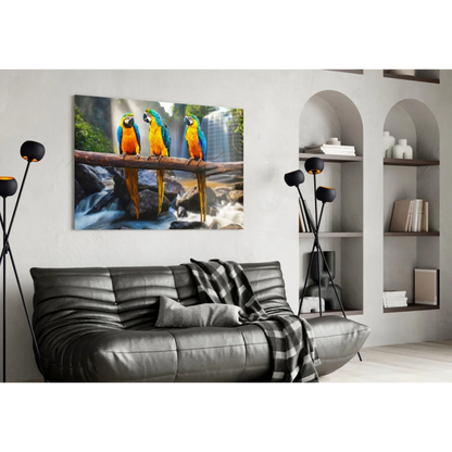 Vibrant blue and yellow macaws on branch by waterfall canvas wall art