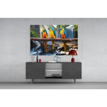 Vibrant blue yellow green macaw wall art canvas print over waterfall