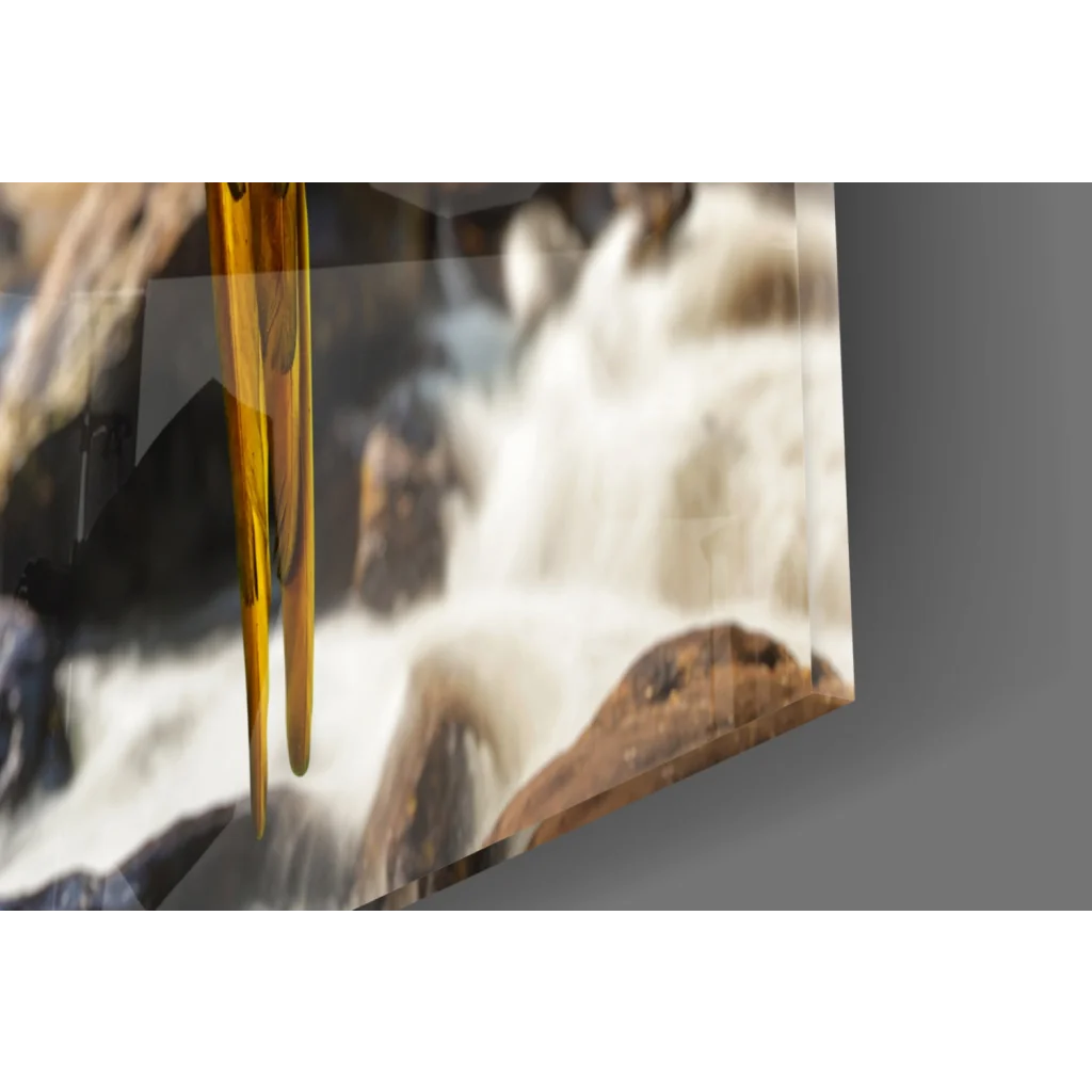 Golden glass pendant in Tropical Macaw wall art against waterfall