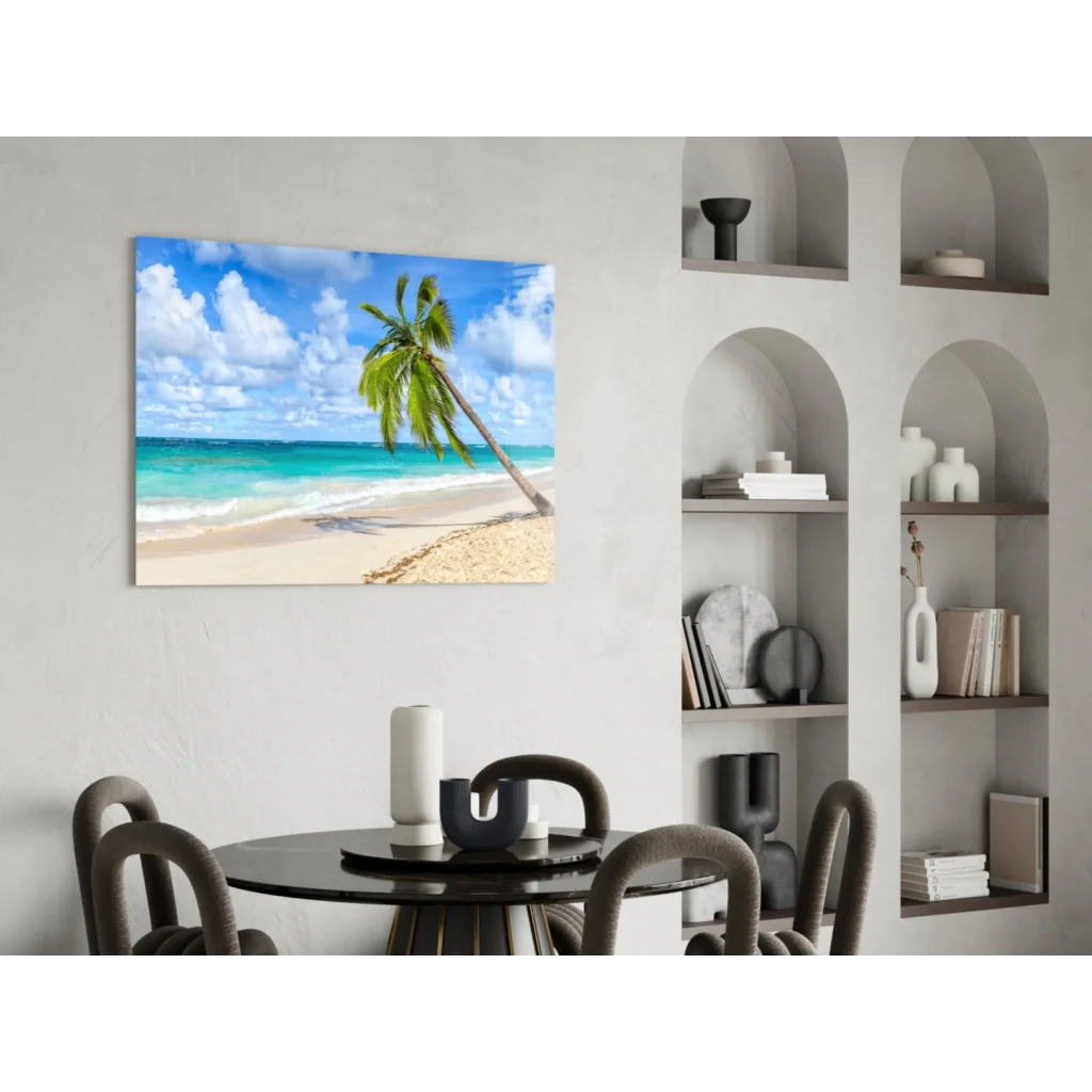 Vibrant leaning palm tree glass wall art on tropical beach with turquoise waters