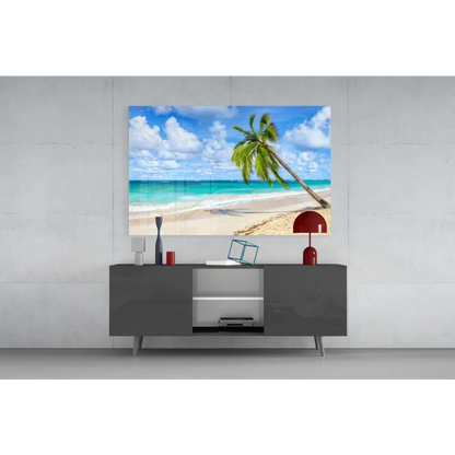 Leaning palm tree glass wall art on turquoise beach scene