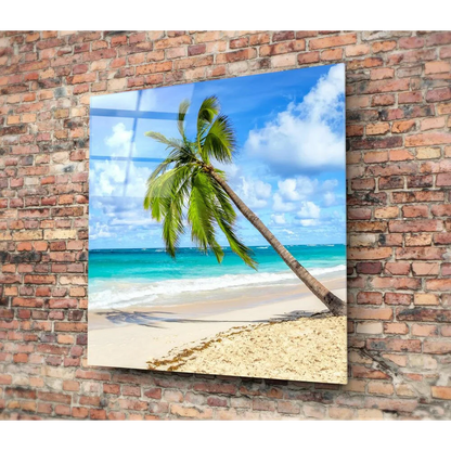Vibrant tropical paradise glass wall art with palm tree over turquoise ocean
