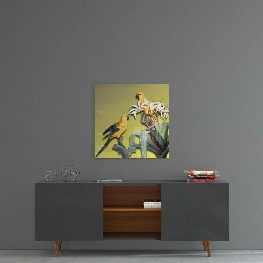 Vibrant yellow parrots on white lily in tropical glass wall art