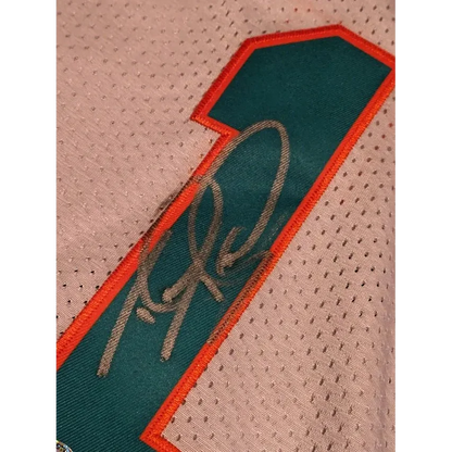 White Tua Tagovailoa Miami Dolphins autographed jersey with teal and orange number 1