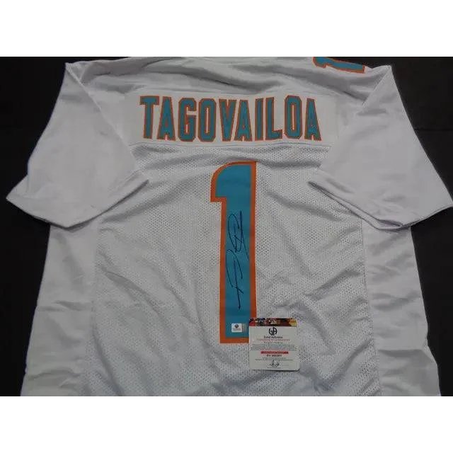 White Tua Tagovailoa Miami Dolphins autographed jersey with autograph and authentication sticker
