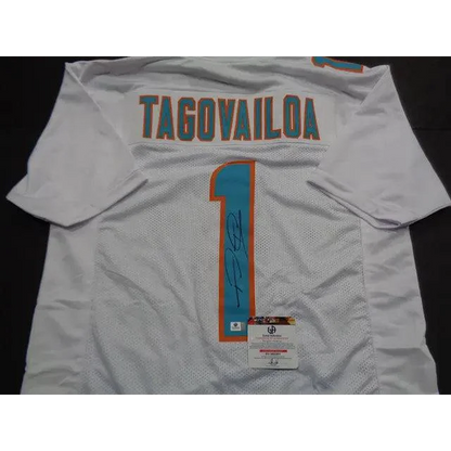 White Tua Tagovailoa Miami Dolphins autographed jersey with autograph and authentication sticker