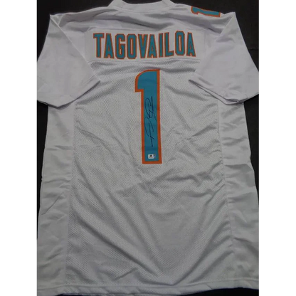 White Tua Tagovailoa Miami Dolphins autographed jersey with signature and number 1