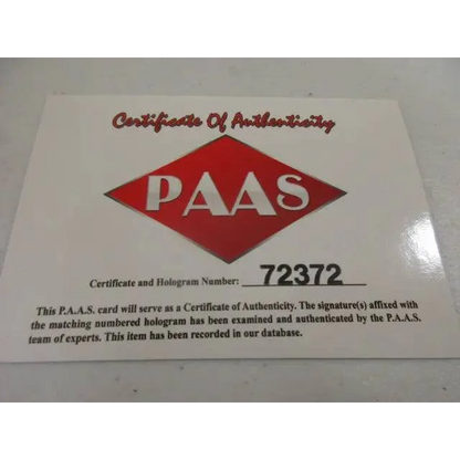 Certificate of Authenticity with red logo and serial number for Tua Tagovailoa Miami Dolphins Funko Pop