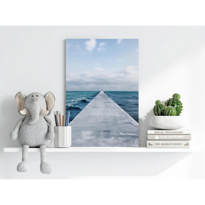 Serene turquoise ocean pier with solitary figure, canvas print
