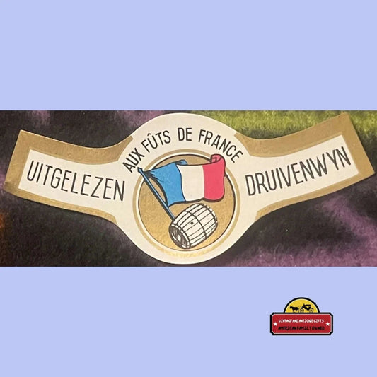 Vintage-style label for Uitgelezen Druivenwijn with French flag and wine barrel. Antique gifts