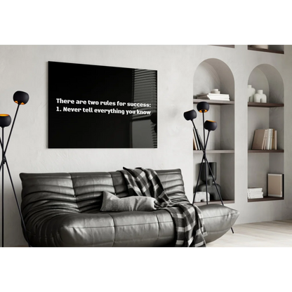 Black rectangular wall art with white text: there are two rules for success: 1