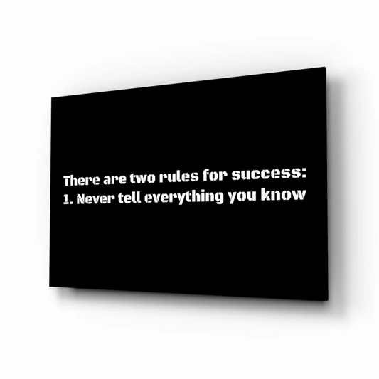 Black canvas wall art with bold white text: there are two rules for success: 1