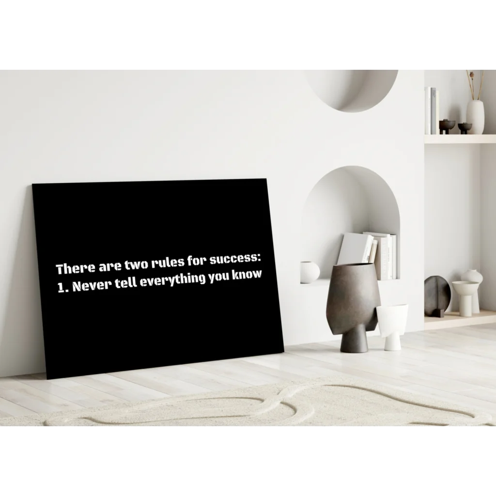 Black canvas wall art with white text: there are two rules for success 1