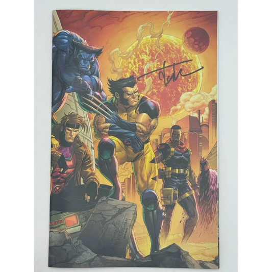 Signed comic book featuring Wolverine and X-Men characters by Tyler Kirkham against fiery background
