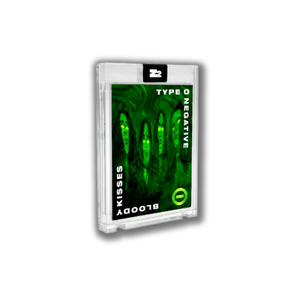 A translucent plastic cassette tape case with green swirling design and white text type o negative bloody kisses deluxe bundle