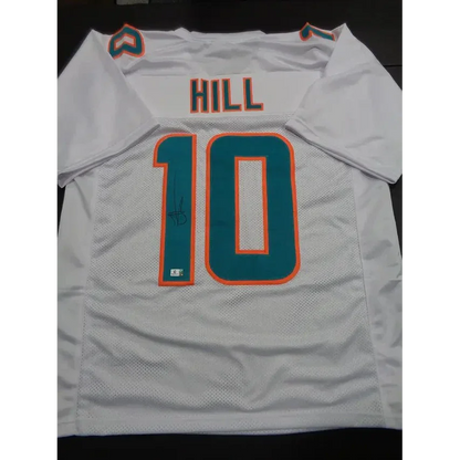 White Tyreek Hill Miami Dolphins autographed jersey with teal and orange accents