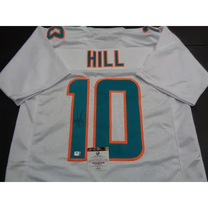 White Tyreek Hill Miami Dolphins autographed jersey with teal and orange details
