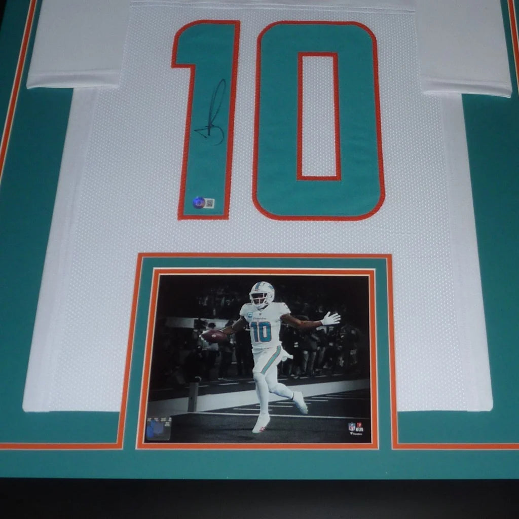 Framed Tyreek Hill signed Miami Dolphins jersey in white and teal