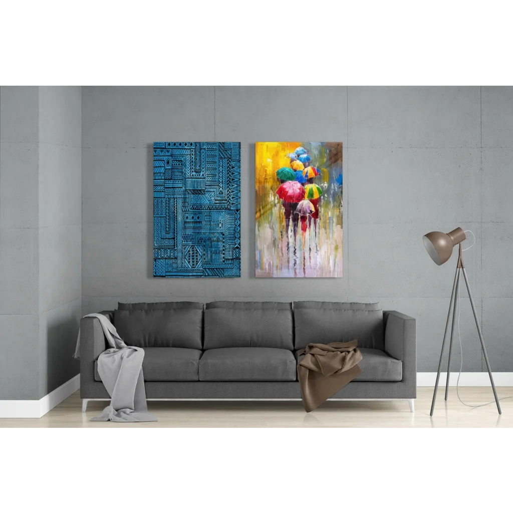 Stunning glass wall art set with blue geometric patterns and colorful umbrellas above gray sofa