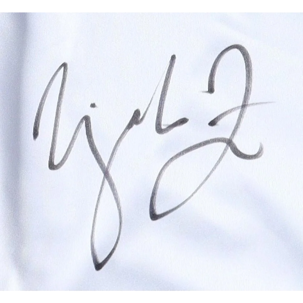 Urijah Faber signature on white surface for WEC Featherweight Championship shorts