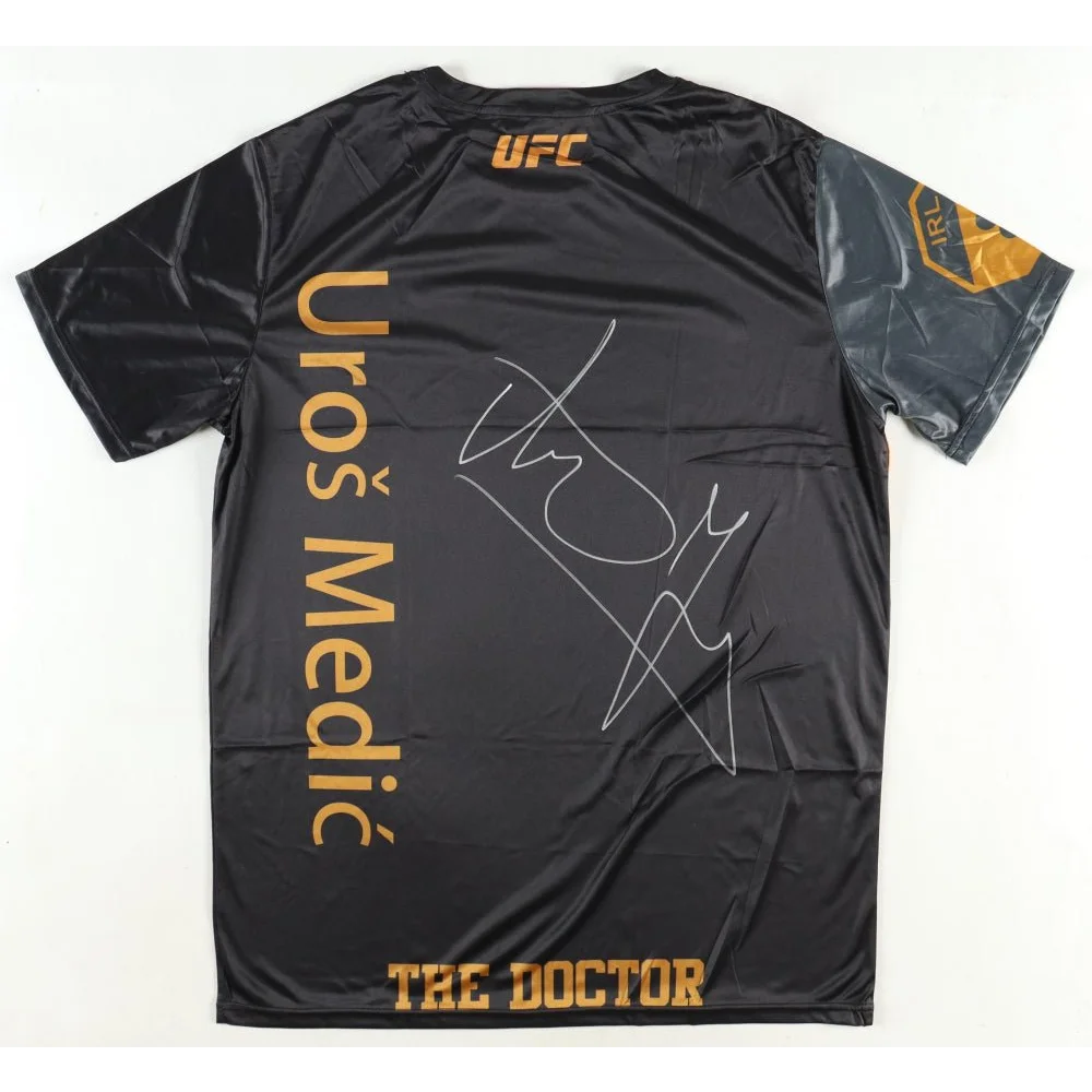 Black Uros Medic UFC t-shirt with gold signature and Beckett authentication