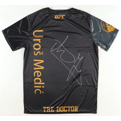 Black Uros Medic UFC t-shirt with gold signature and Beckett authentication